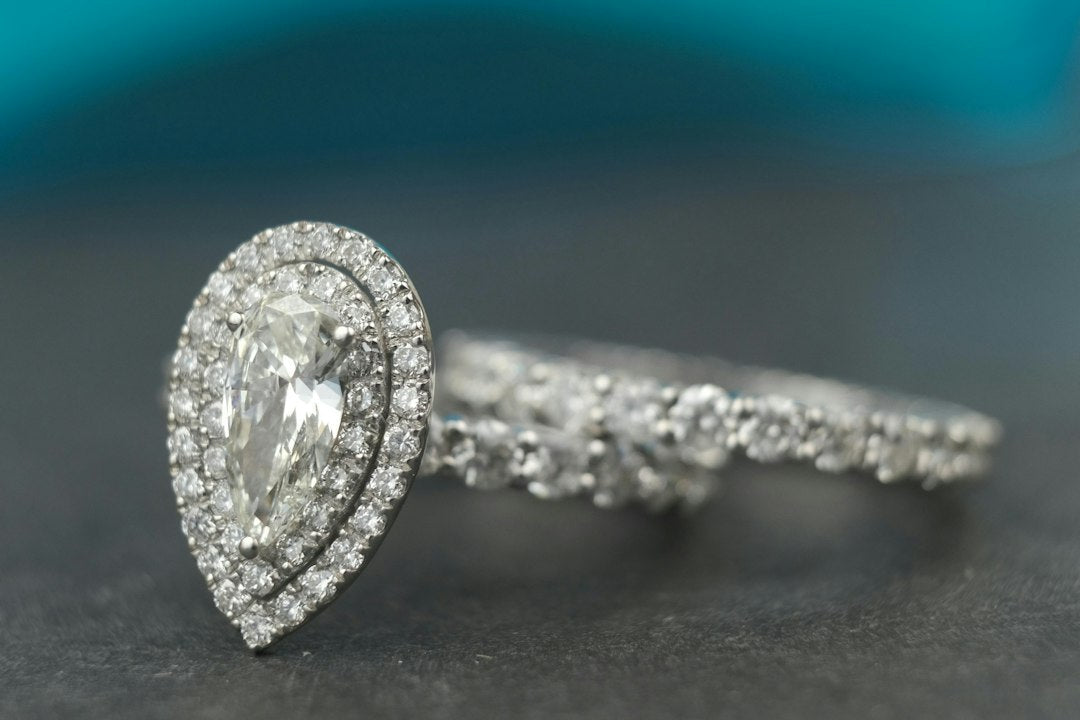 The Smart Way to Wear a Pear-Shaped Ring with a Wedding Band