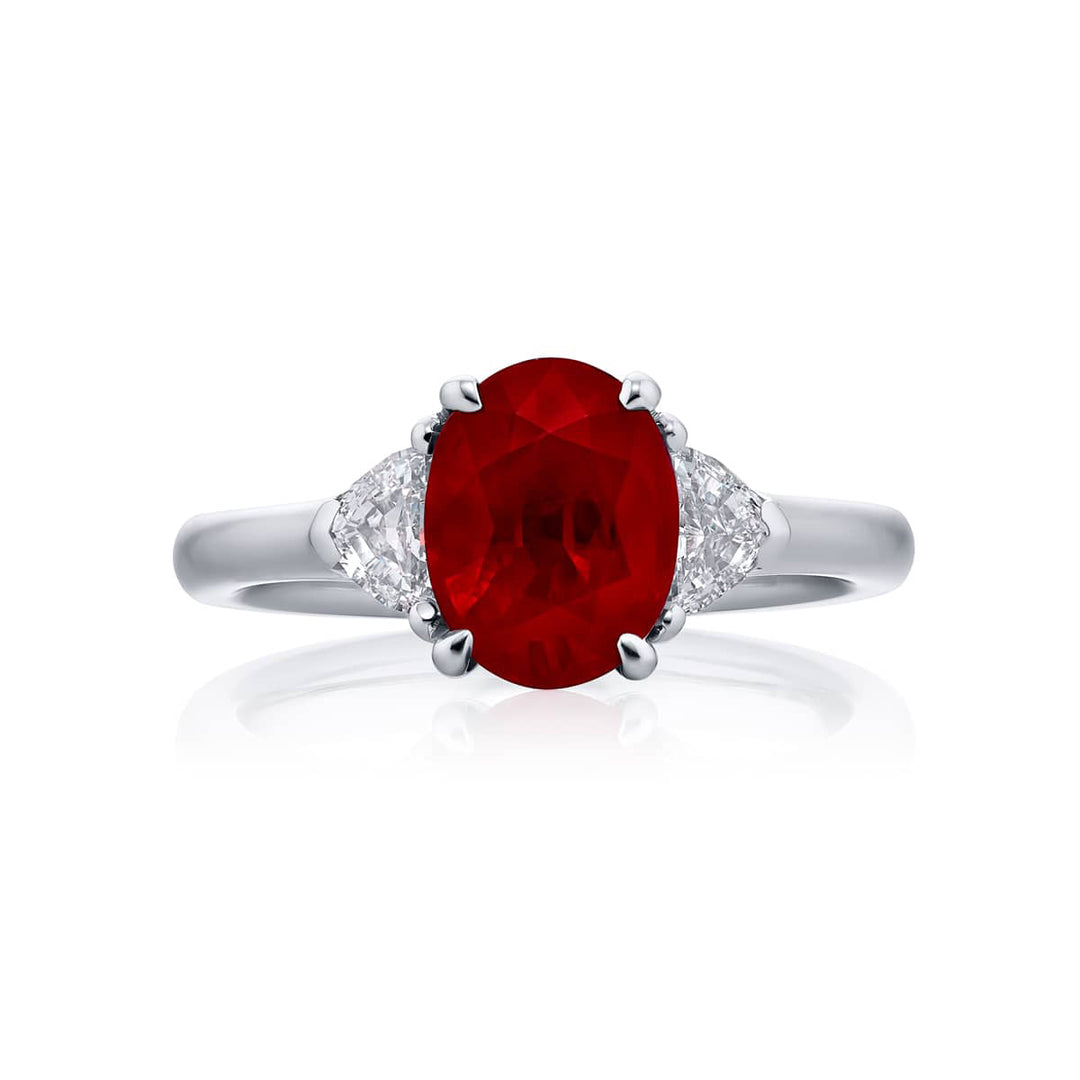 Breathtaking Radiance: Our stunning 2.12 ct. certified Burmese Ruby Ring. This beautiful vivid oval ruby flanked by epaulette diamonds is handcrafted in pure platinum.