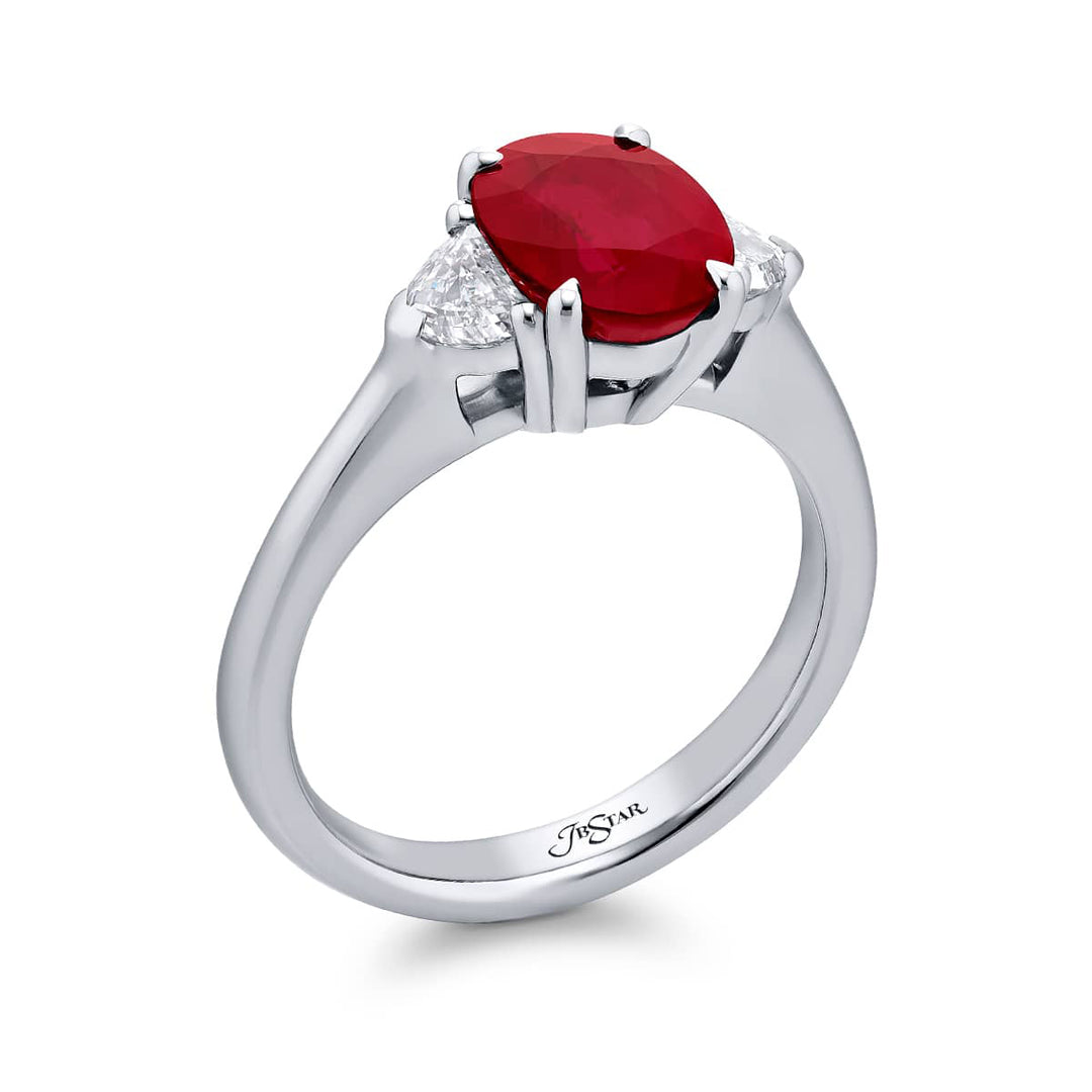 Breathtaking Radiance: Our stunning 2.12 ct. certified Burmese Ruby Ring. This beautiful vivid oval ruby flanked by epaulette diamonds is handcrafted in pure platinum.