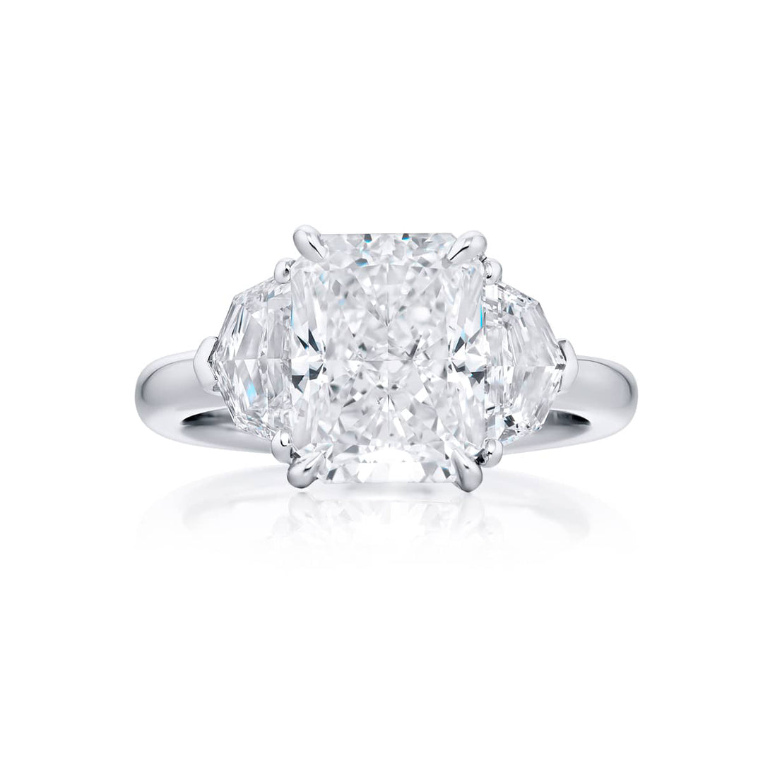 Dazzling Brilliance: Our timeless 4.02 ct. GIA certified Diamond Ring. This radiant-cut diamond flanked by epaulette diamonds is handcrafted in pure platinum.