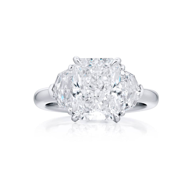 Dazzling Brilliance: Our timeless 4.02 ct. GIA certified Diamond Ring. This radiant-cut diamond flanked by epaulette diamonds is handcrafted in pure platinum.