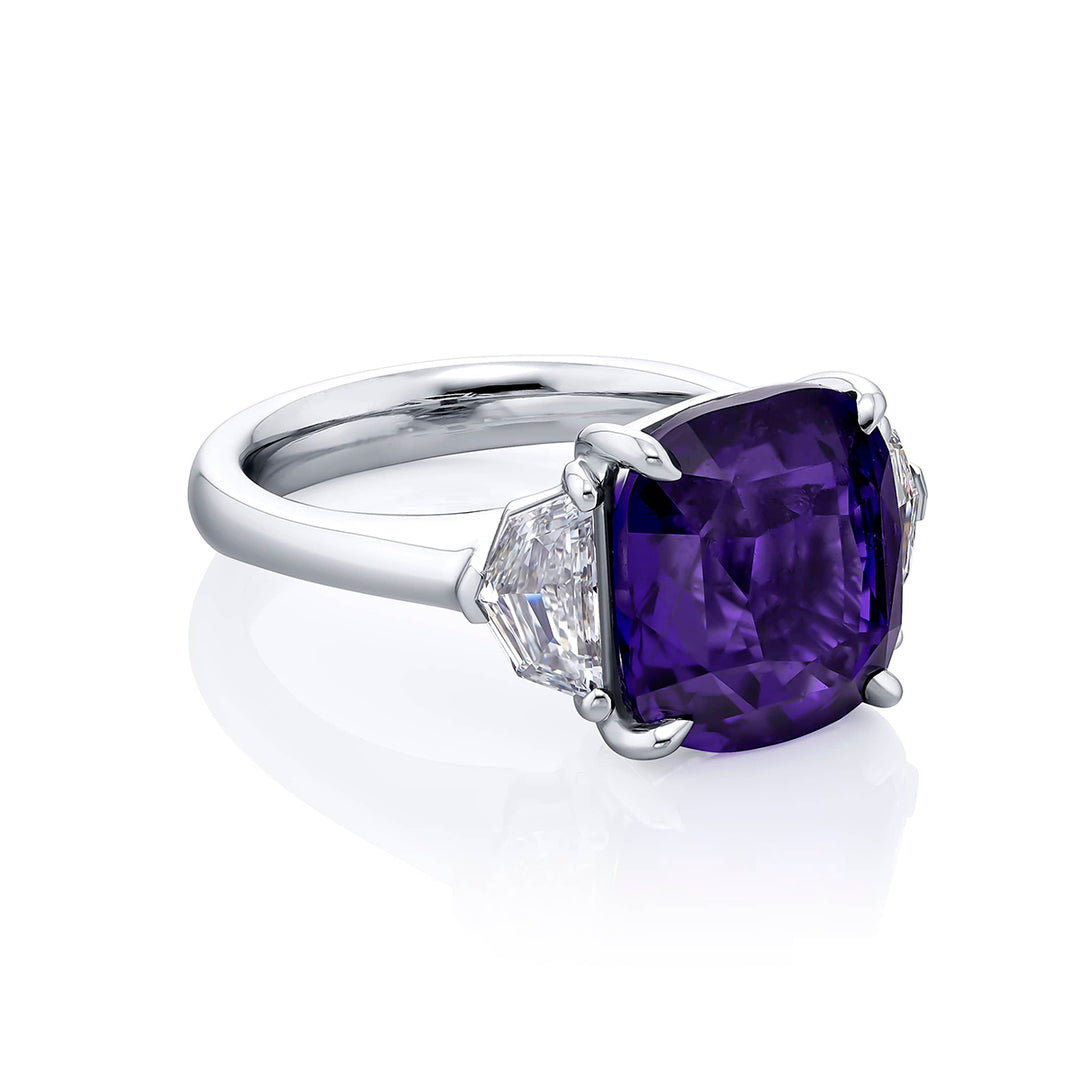 Breathtaking Radiance: Our magnificent 8.50 ct. certified No-Heat Purple Sapphire Ring. This beautiful cushion-cut purple sapphire flanked by epaulette diamonds is handcrafted in pure platinum.