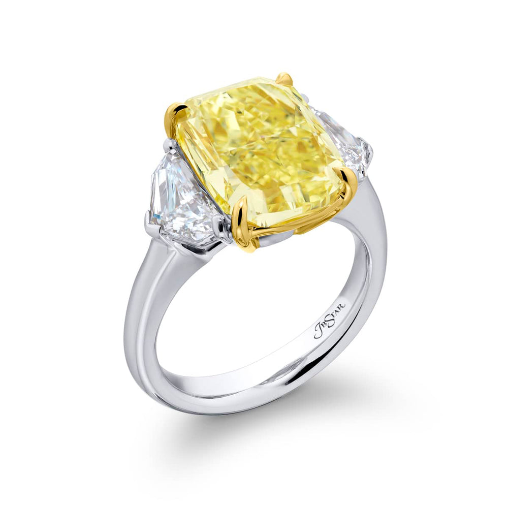 Dazzling Brilliance: Our magnificent 6.02 ct. GIA certified Fancy Yellow Diamond Ring. This stunning cushion-cut fancy yellow diamond flanked by epaulet diamonds is handcrafted in pure platinum and 18KY gold.