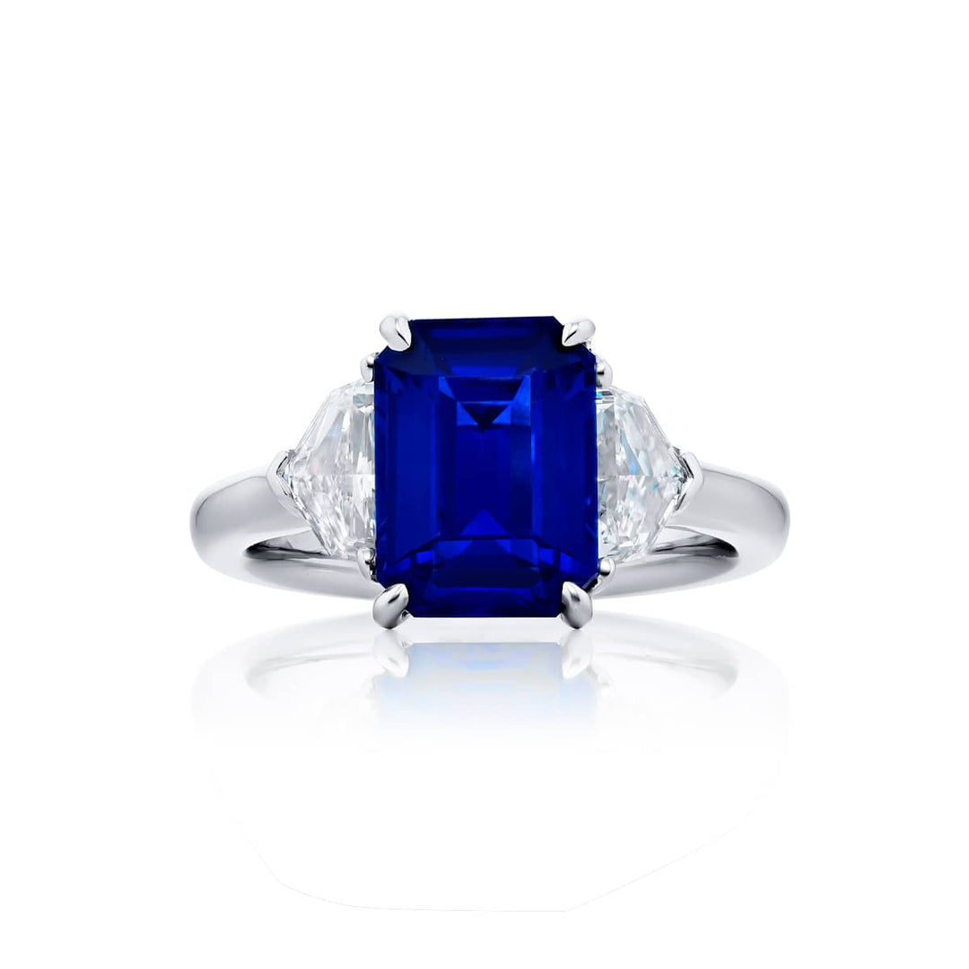Breathtaking Radiance: Our stunning 3.76 ct. GIA certified Sapphire Ring. This gorgeous emerald-cut sapphire embraced by epaulette diamonds is handcrafted in pure platinum.