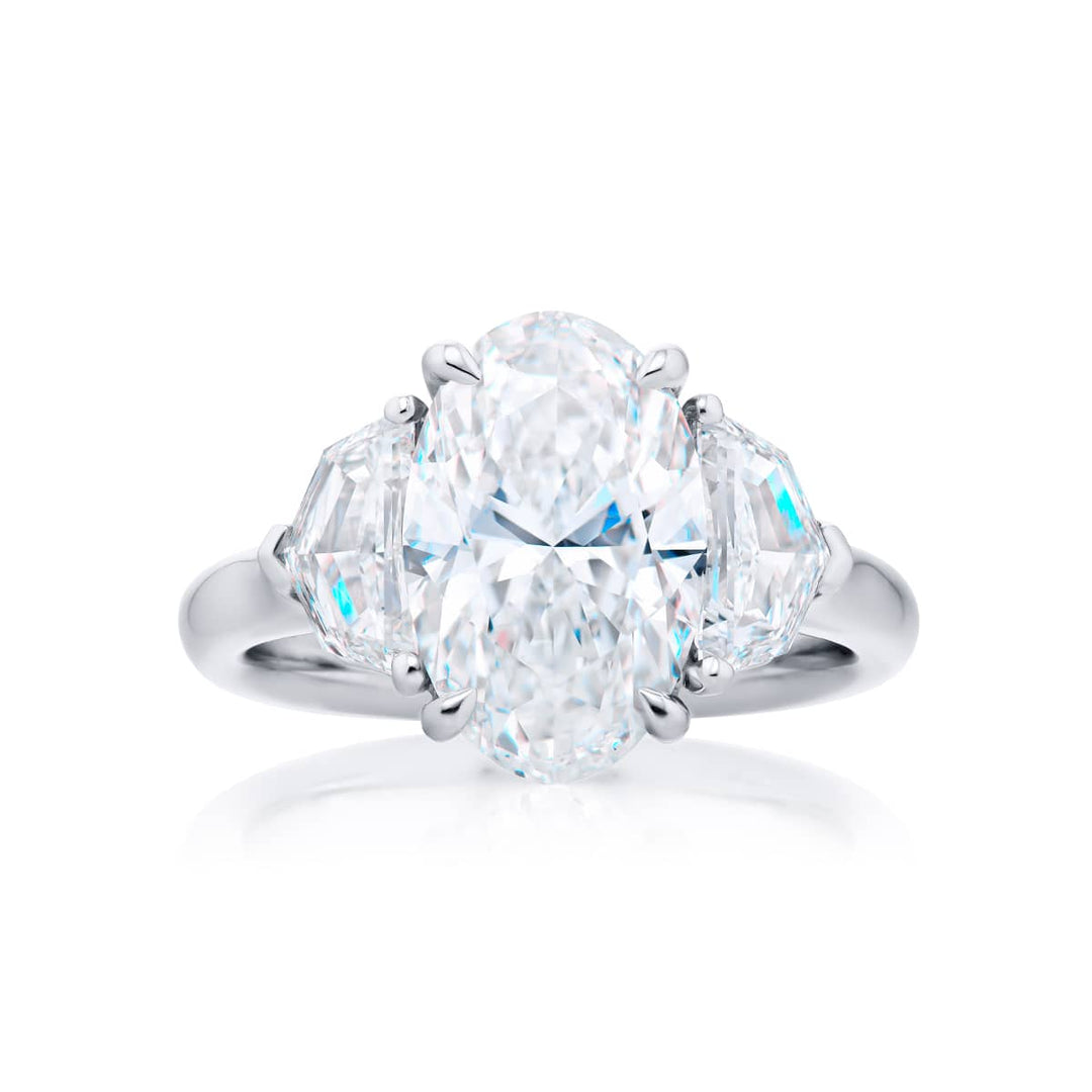 Dazzling Brilliance: Our timeless 3.52 ct. GIA certified Diamond Ring. This oval diamond flanked by stunning epaulette diamonds is handcrafted in pure platinum.