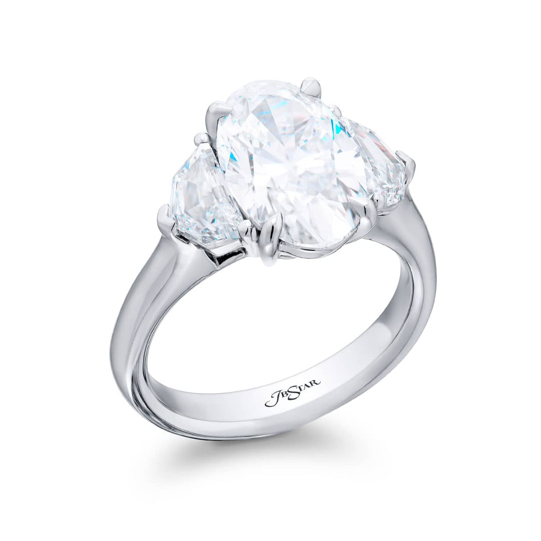 Dazzling Brilliance: Our timeless 3.52 ct. GIA certified Diamond Ring. This oval diamond flanked by stunning epaulette diamonds is handcrafted in pure platinum.