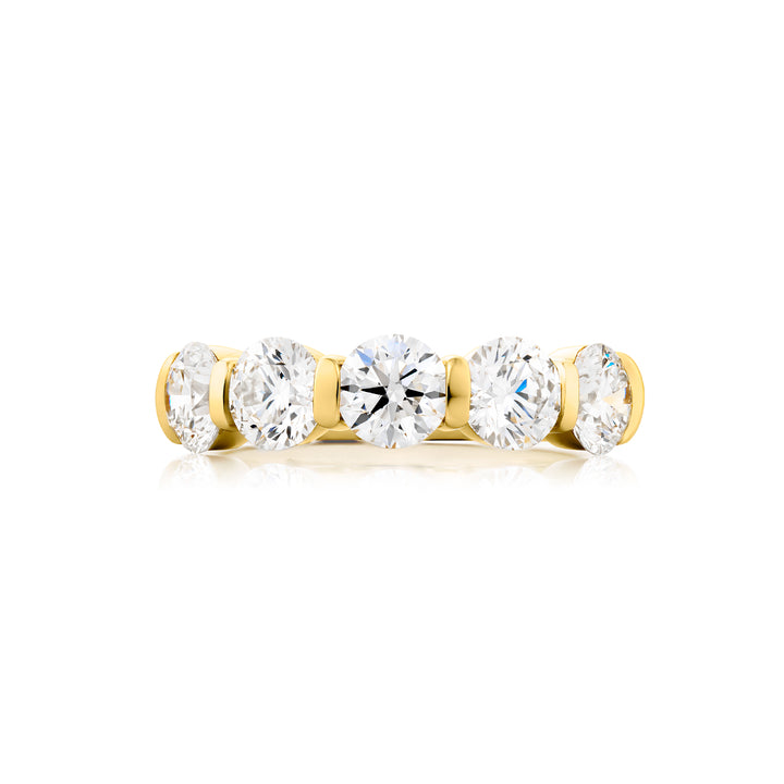 Elegance Elevated: Our stunning 2.72 ctw. Bar Set Diamond Band. These five beautiful round diamonds are handcrafted in 18K yellow gold.
