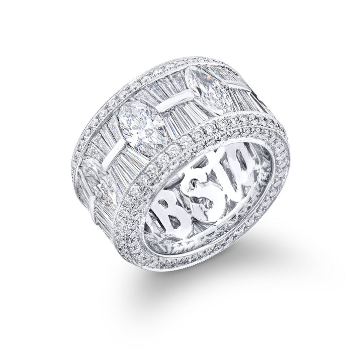 Gorgeous diamond eternity band feautring stunning tapered baguette and marquise diamonds in channel setting all edged in micro pave. Handcrafted in pure platinum.