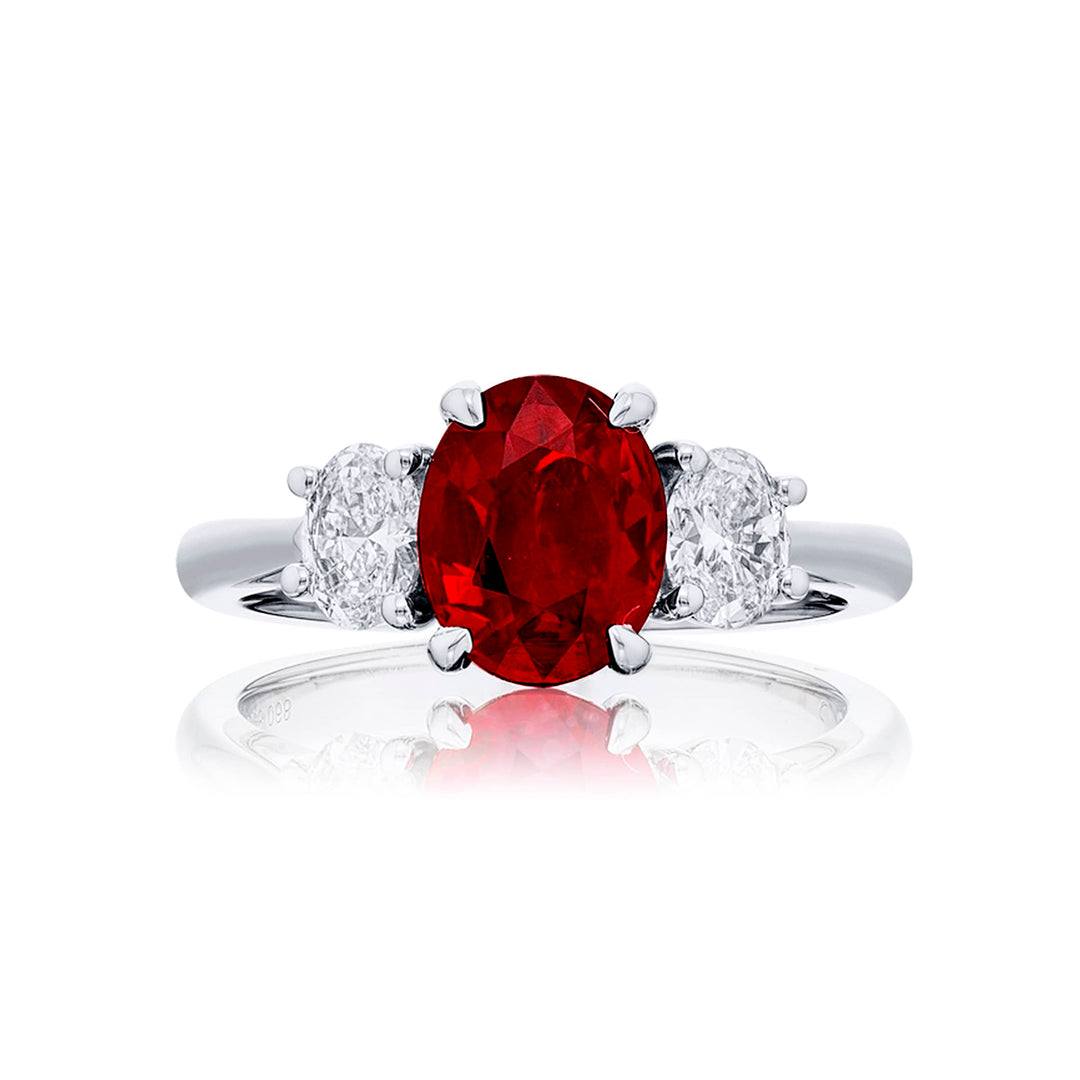Breathtaking Radiance: Our stunning 2.02 ct. certified Burmese Ruby Ring. This beautiful oval ruby flanked by oval diamonds is handcrafted in pure platinum.