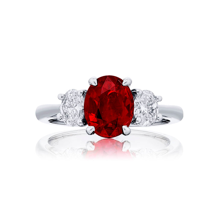 Breathtaking Radiance: Our stunning 2.02 ct. certified Burmese Ruby Ring. This beautiful oval ruby flanked by oval diamonds is handcrafted in pure platinum.