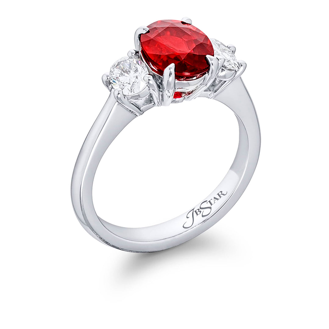 Breathtaking Radiance: Our stunning 2.02 ct. certified Burmese Ruby Ring. This beautiful oval ruby flanked by oval diamonds is handcrafted in pure platinum.