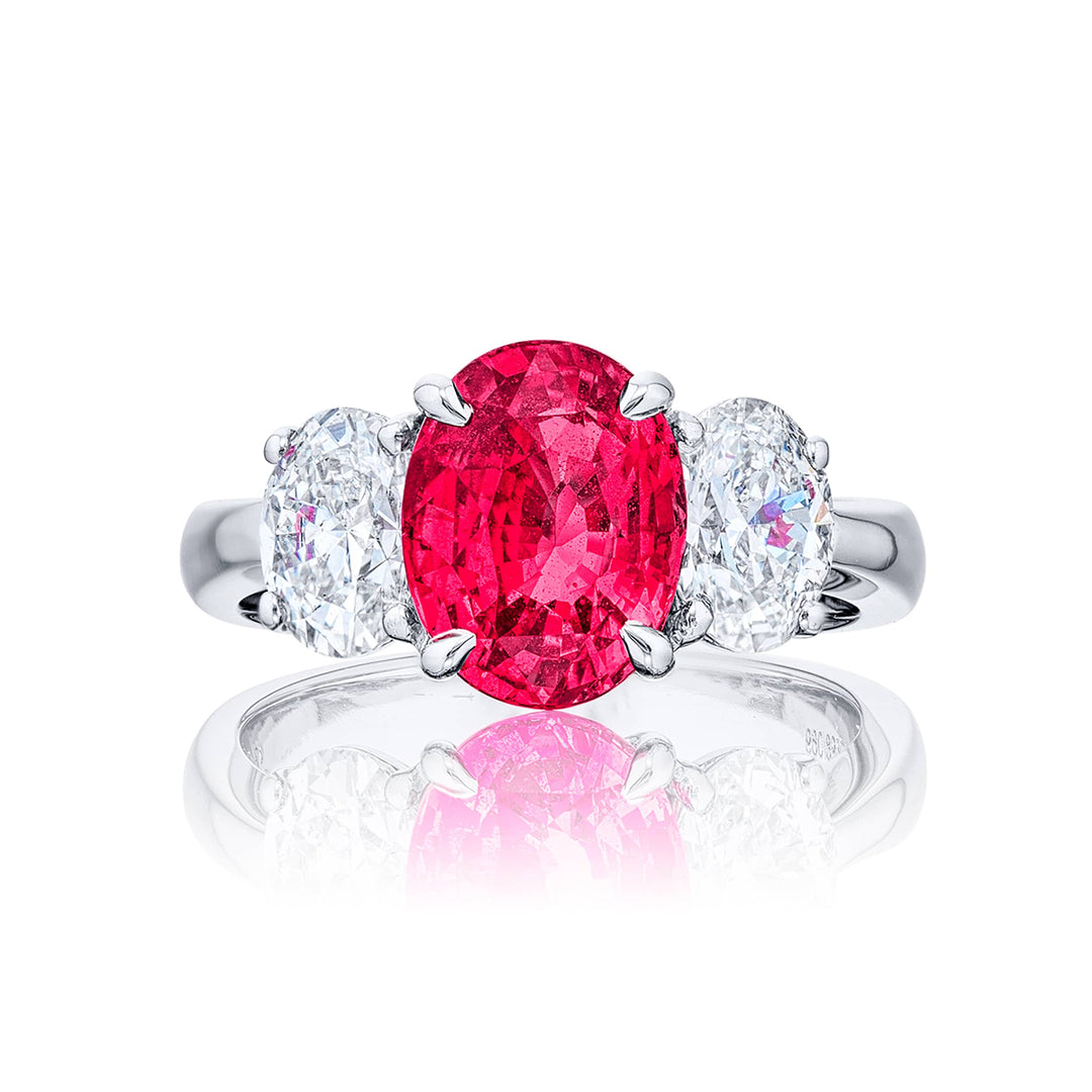 Breathtaking Radiance: Our exquisite 3.01 ct. certified Pink Sapphire Ring. This beautiful oval pink sapphire flanked by oval diamonds is handcrafted in pure platinum.