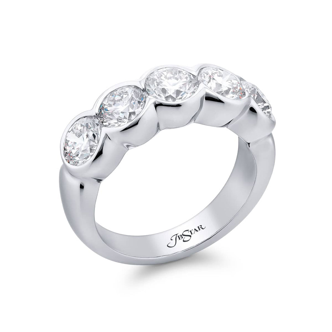 Elegance Elevated: Our signature 2.40 ctw. Bezel Diamond Band. These gorgeous round diamonds are handcrafted in pure platinum.