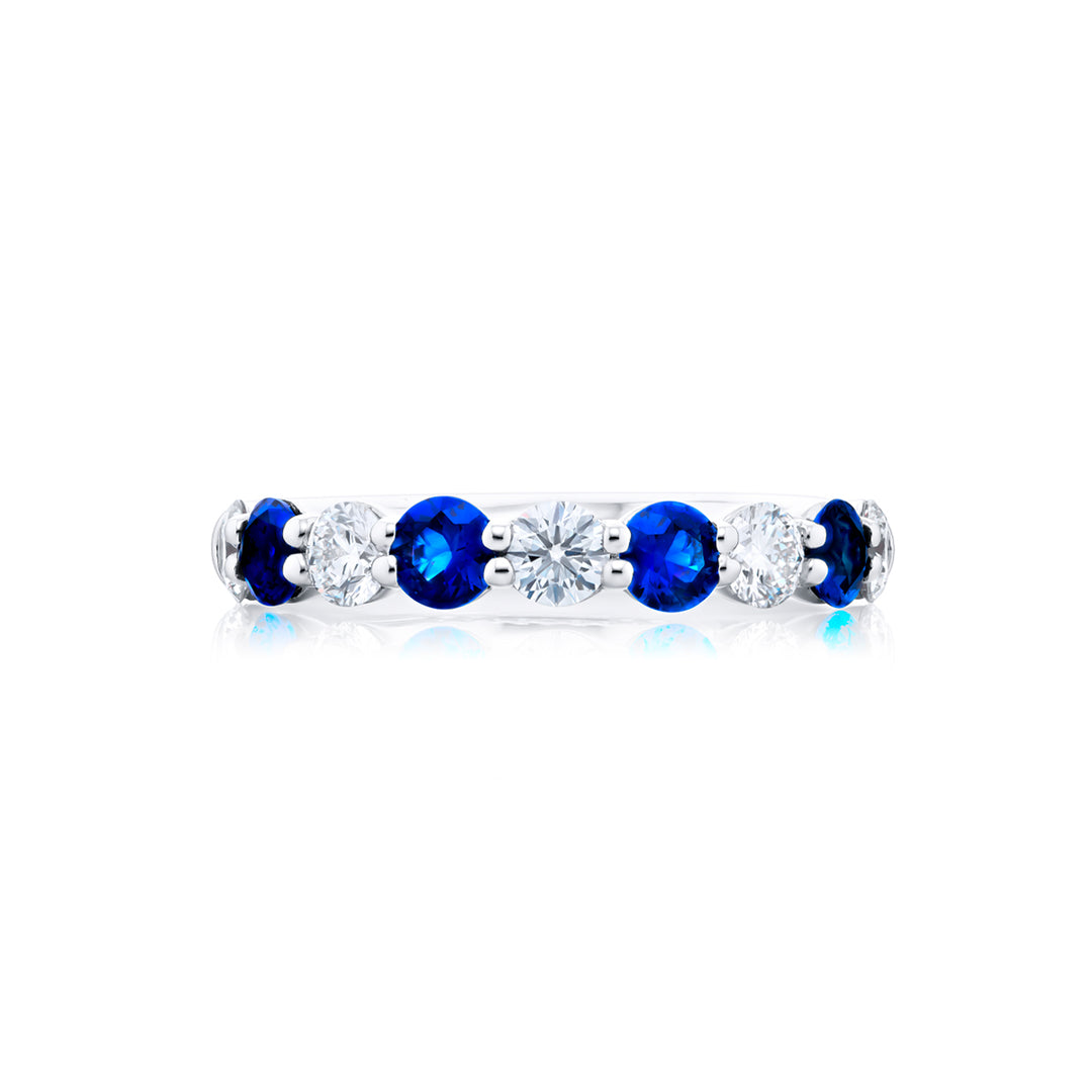 Elegance Elevated: Our classic single row Sapphire and Diamond Band. These stunning round sapphires accompany round diamonds and are handcrafted in pure platinum.