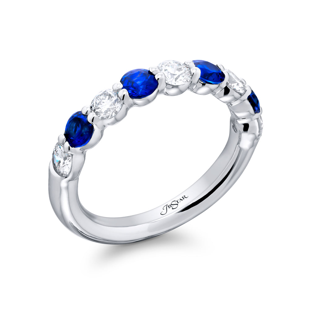 Elegance Elevated: Our classic single row Sapphire and Diamond Band. These stunning round sapphires accompany round diamonds and are handcrafted in pure platinum.