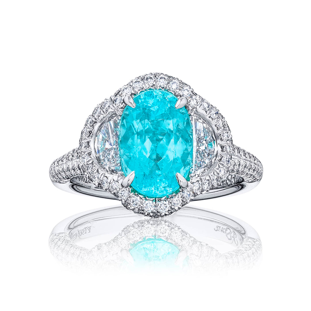 Stunning Paraiba ring featuring a 2.62 ct CDC certified oval embraced by half moon diamonds in a pave setting. Handcrafted in pure platinum.