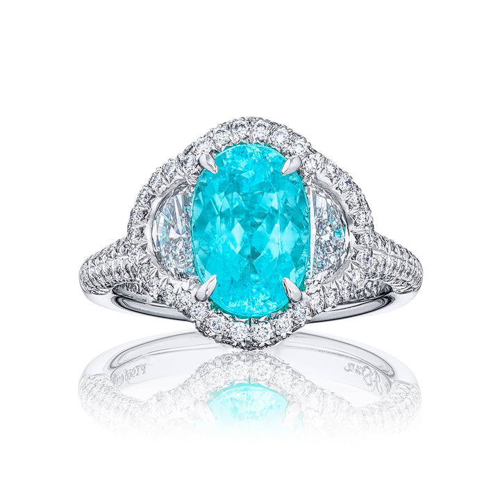 Stunning Paraiba ring featuring a 2.62 ct CDC certified oval embraced by half moon diamonds in a pave setting. Handcrafted in pure platinum.