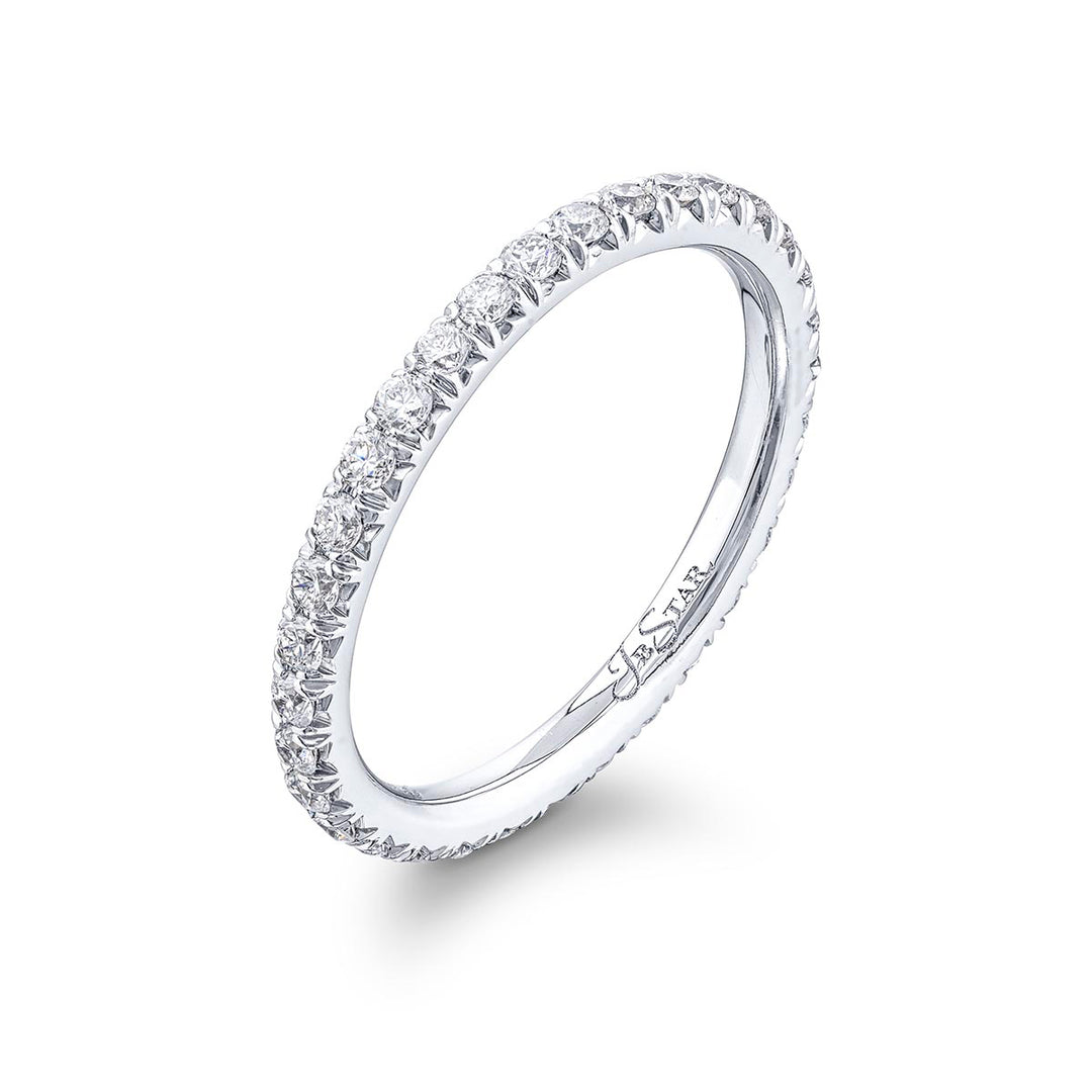 Gorgeous diamond eternity band featuring round diamonds in a cut-down setting. Handcrafted in pure platinum.