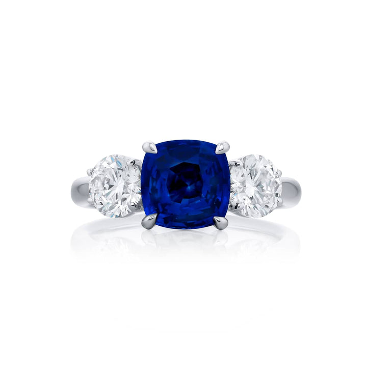 Breathtaking Radiance: Our beautiful 2.53 ct. certified Sapphire Ring. This stunning cushion-cut sapphire flanked by dazzling round diamonds is handcrafted in pure platinum.