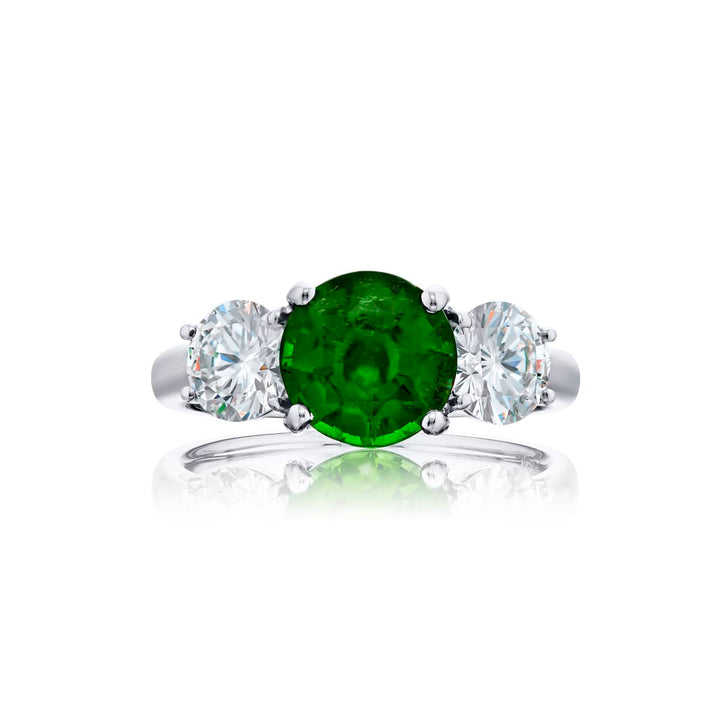 Breathtaking Radiance: Our stunning 2.01 ct. certified Vivid Emerald Ring. This beautiful round vivid emerald flanked by round diamonds is handcrafted in pure platinum.