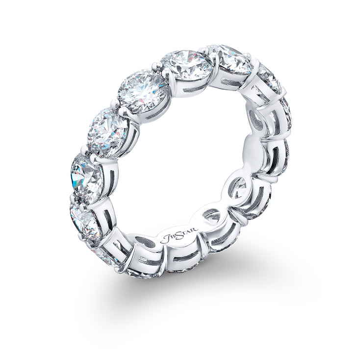 An exquisite eternity band meticulously handcrafted in pure platinum showcasing 14 round diamonds elegantly set within a shared prong arrangement exuding timeless allure.