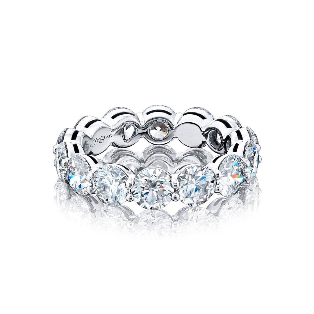 An exquisite eternity band meticulously handcrafted in pure platinum showcasing 14 round diamonds elegantly set within a shared prong arrangement exuding timeless allure.