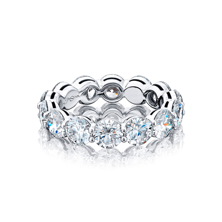 An exquisite eternity band meticulously handcrafted in pure platinum showcasing 14 round diamonds elegantly set within a shared prong arrangement exuding timeless allure.