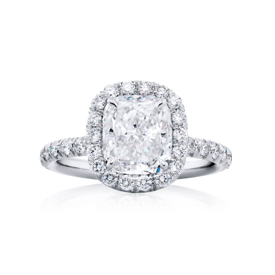 Dazzling Brilliance: Our timeless 1.92 ct. GIA certified Diamond Ring. This gorgeous cushion-cut diamond encircled by micro pave diamonds is handcrafted in pure platinum.