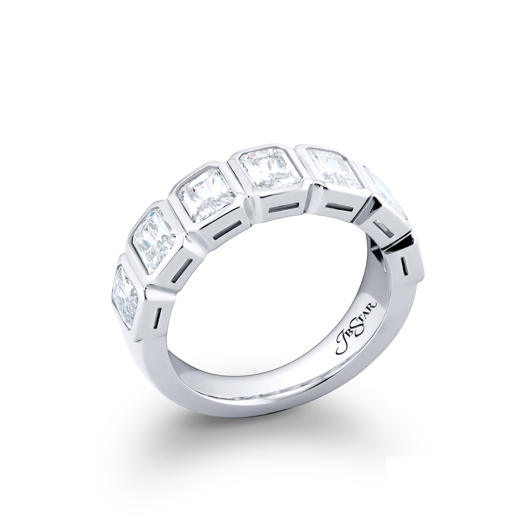 Elegance Elevated: Our classic 2.67 ctw. Bezel Diamond Band. These seven stunning radiant-cut diamonds are handcrafted in pure platinum.