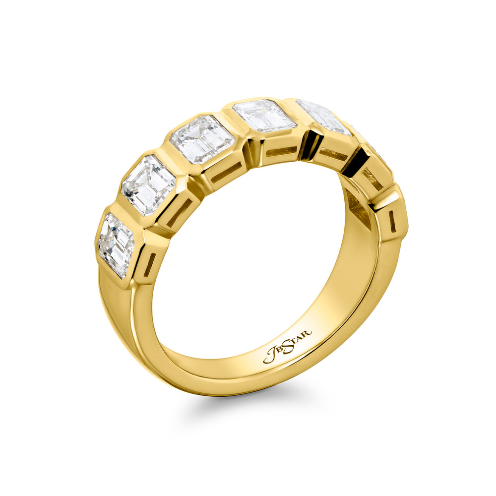 Elegance Elevated: Our stunning 2.52 ctw. Bezel Diamond Band. These seven beautiful emerald-cut diamonds are handcrafted in 18KY gold.