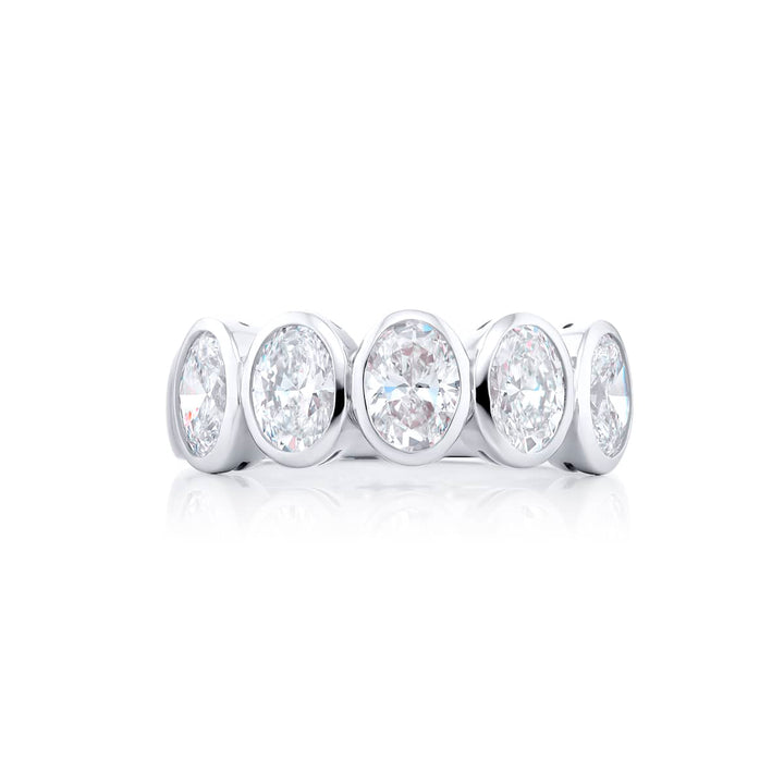 Elegance Elevated: Our classic 2.06 ctw. Bezel Diamond Band. These five stunning oval diamonds are handcrafted in pure platinum.