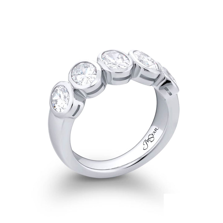 Elegance Elevated: Our classic 2.06 ctw. Bezel Diamond Band. These five stunning oval diamonds are handcrafted in pure platinum.