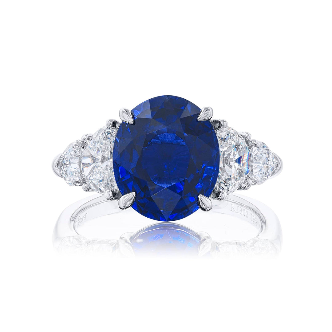 Stunning sapphire and diamond ring featuring a 5.96 ct. GRS certified vivid oval sapphire embraced half-moon and 2 shield diamonds. Handcrafted in pure platinum.