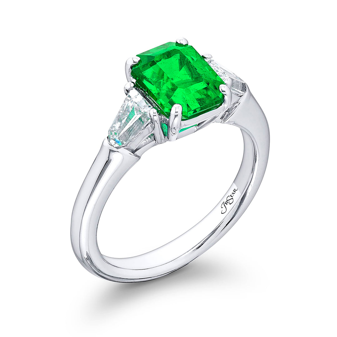Breathtaking Radiance: Our elegant 2.04 ct. certified Emerald Ring. This beautiful vivid emerald-cut emerald flanked by bullet diamonds is handcrafted in pure platinum.