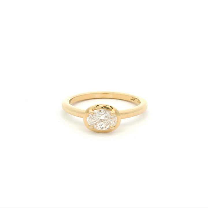 Bezel prong gold ring with oval diamond