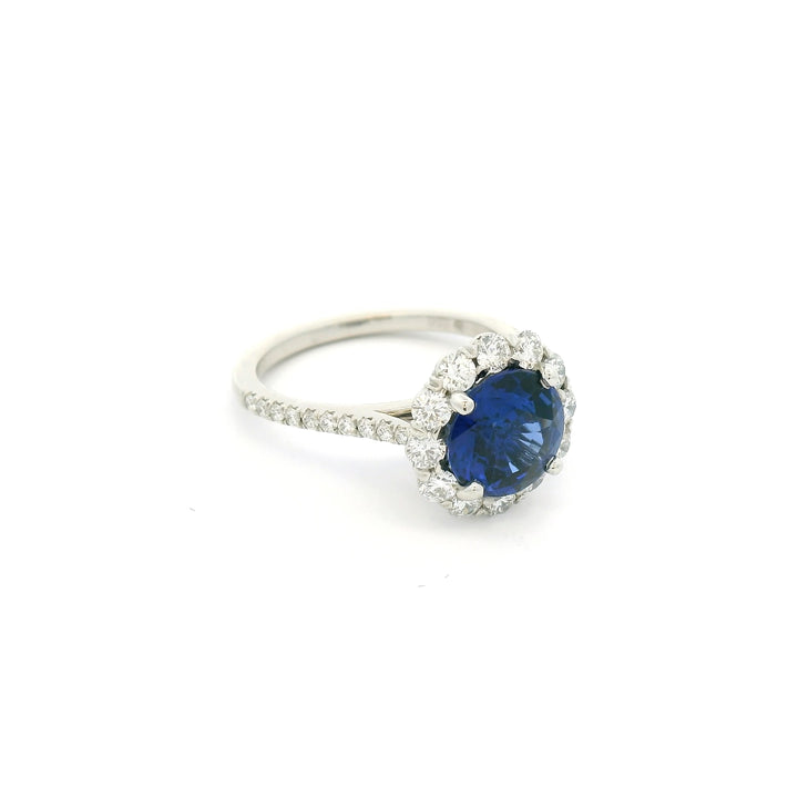 Platinum ring with a blue Sapphire and diamond halo
