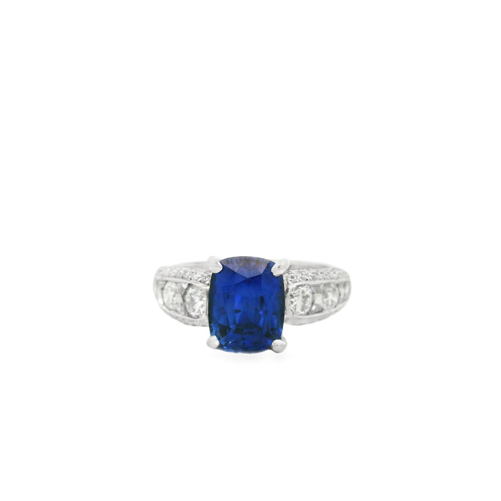 Platinum ring with a center cushion Sapphire and diamond pave sides