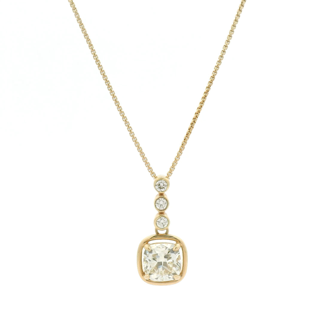 14K yellow gold necklace with bezel and floating set diamonds