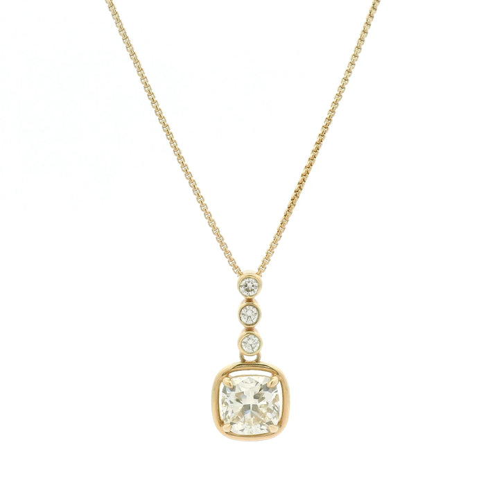 14K yellow gold necklace with bezel and floating set diamonds