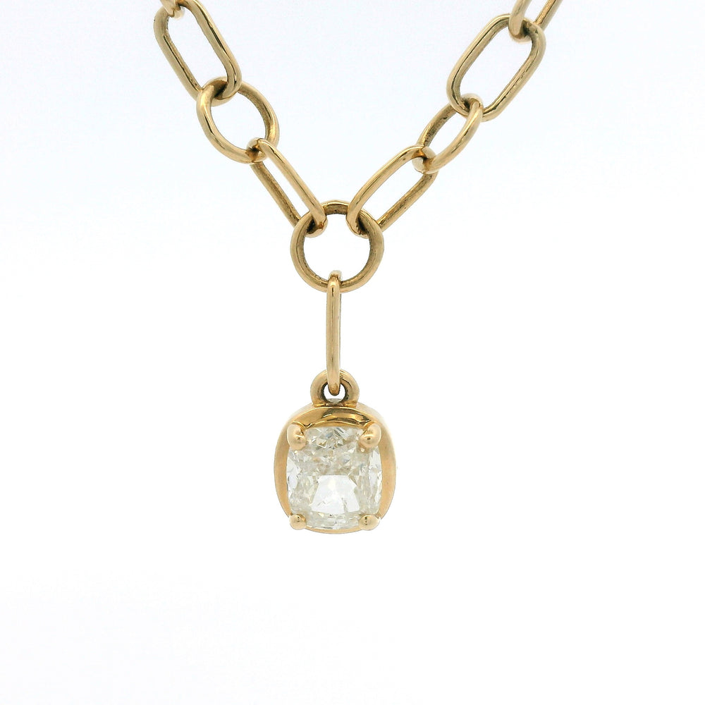 Yellow gold link chain with bezel set cushion