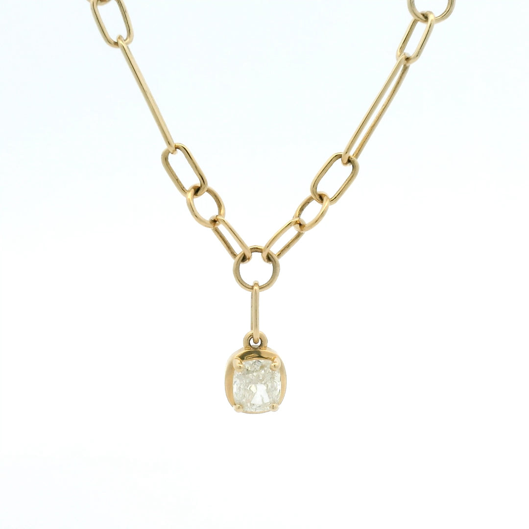 Yellow gold link chain with bezel set cushion