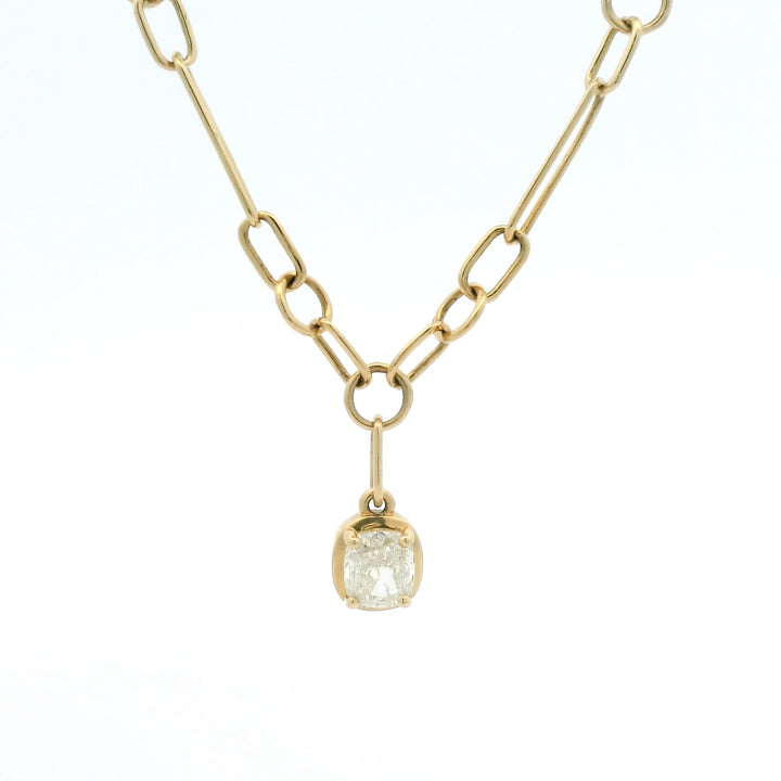 Yellow gold link chain with bezel set cushion