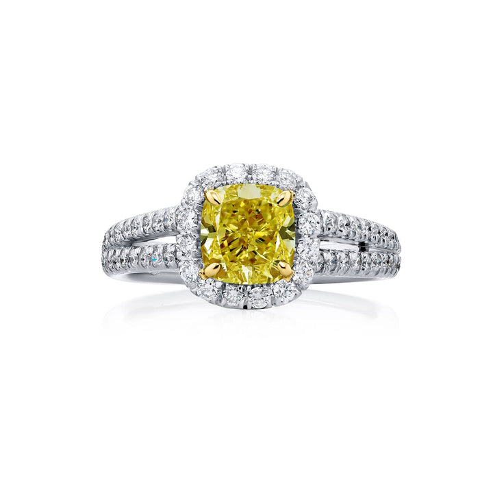 Dazzling Brilliance: Our beautiful 1.19 ct. GIA certified Fancy Yellow Diamond Ring. This cushion-cut fancy yellow diamond accompanied by round diamonds is handcrafted in pure platinum and 18KY gold.