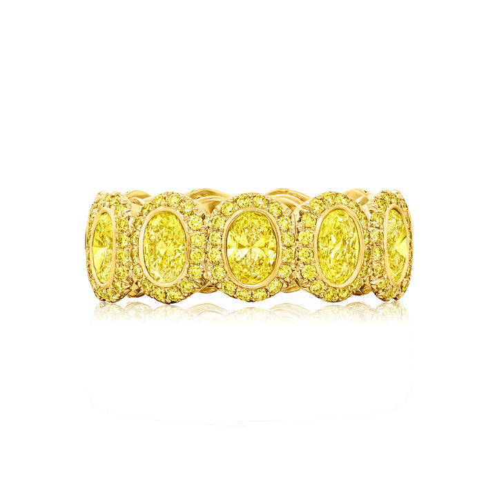 Alluring Eternity: Our signature 3.20 ctw.  Bezel Fancy Yellow Diamond Band. These gorgeous oval fancy yellow diamonds blended with round diamonds are handcrafted in 18KY gold.