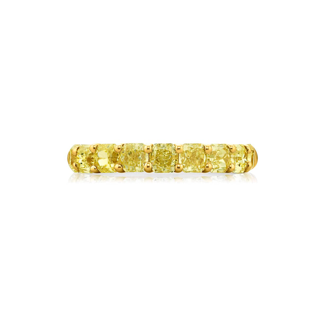 Elegance Elevated: Our classic single row Fancy Yellow Diamond Band. These nine stunning radiant-cut fancy yellow diamonds are handcrafted in 18KY gold and pure platinum.