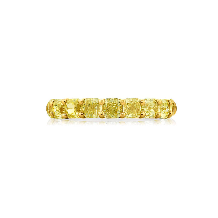 Elegance Elevated: Our classic single row Fancy Yellow Diamond Band. These nine stunning radiant-cut fancy yellow diamonds are handcrafted in 18KY gold and pure platinum.