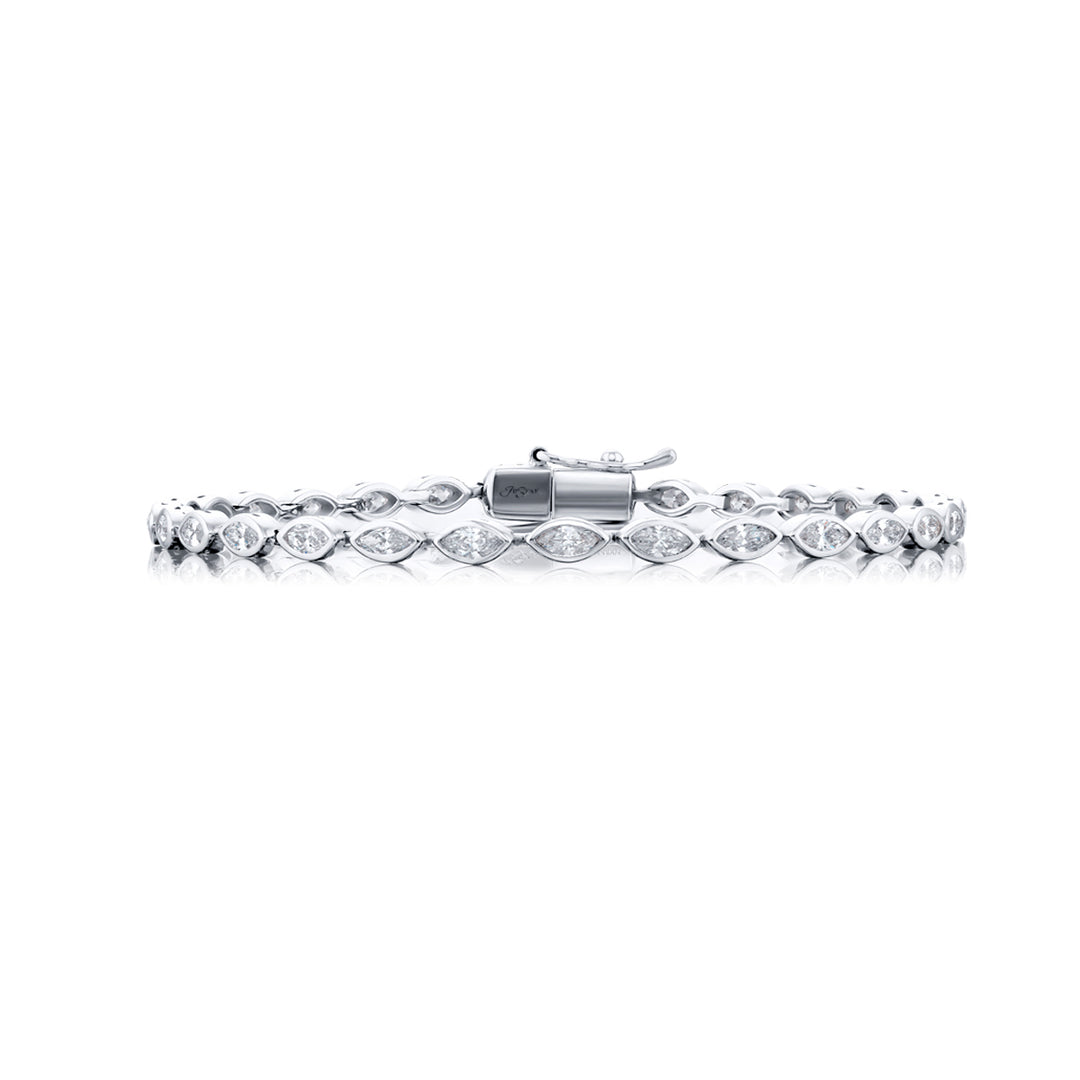 Unbridled Beauty: Our stunning 2.45 ctw. single-row Bezel Diamond Bracelet. These dazzling twenty-nine marquise diamonds are handcrafted in pure platinum.