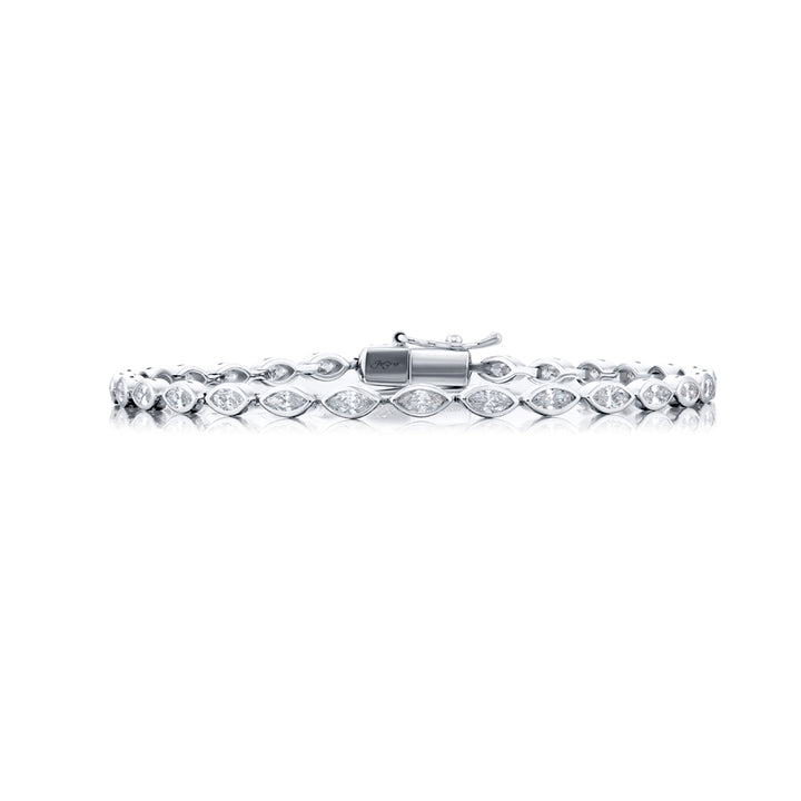 Unbridled Beauty: Our stunning 2.45 ctw. single-row Bezel Diamond Bracelet. These dazzling twenty-nine marquise diamonds are handcrafted in pure platinum.