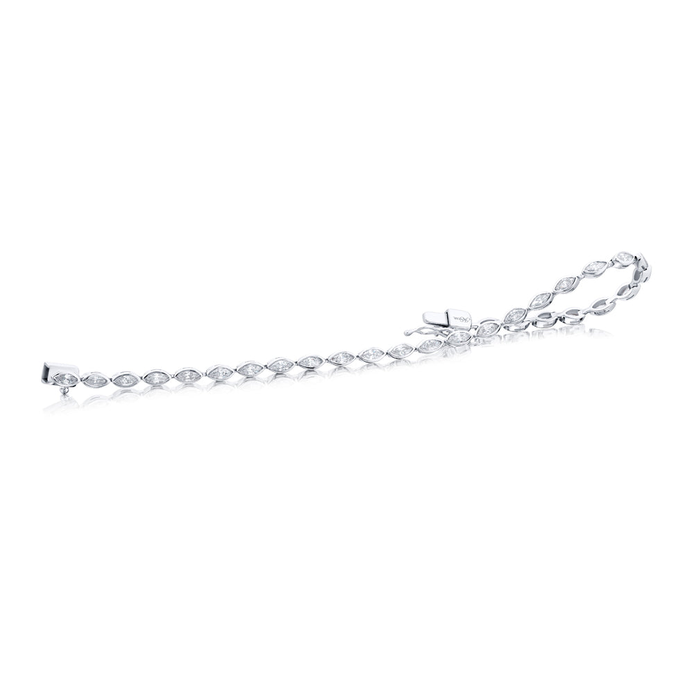 Unbridled Beauty: Our stunning 2.45 ctw. single-row Bezel Diamond Bracelet. These dazzling twenty-nine marquise diamonds are handcrafted in pure platinum.
