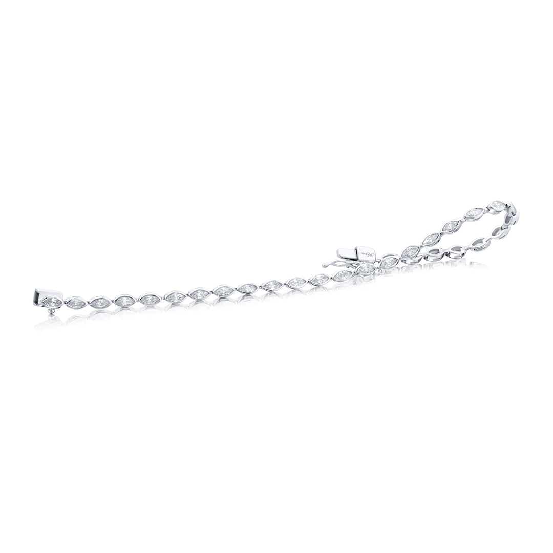 Unbridled Beauty: Our stunning 2.45 ctw. single-row Bezel Diamond Bracelet. These dazzling twenty-nine marquise diamonds are handcrafted in pure platinum.